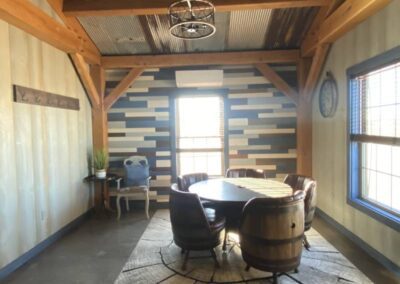 a room with a wooden table and chairs